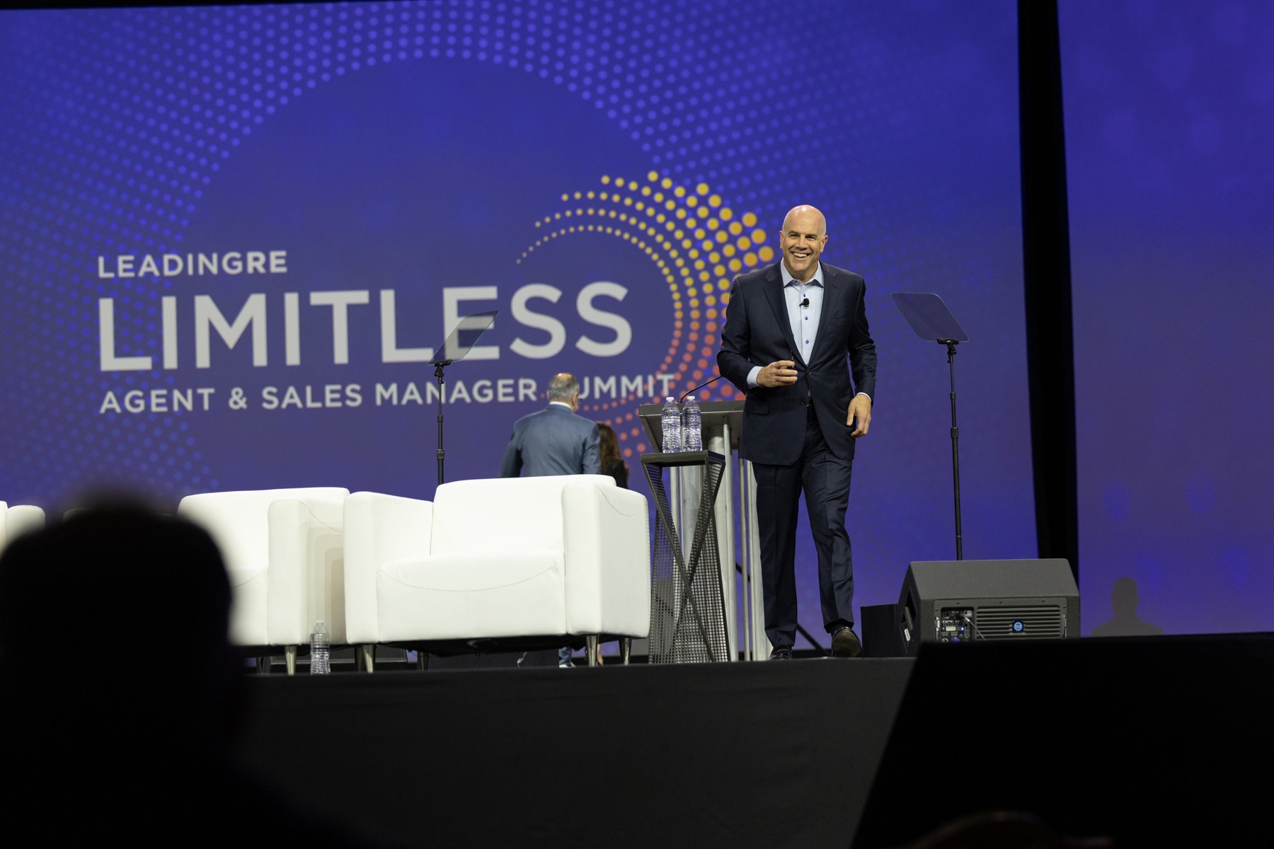 David Childers speaking on stage at the LeadingRE Limitless Summit